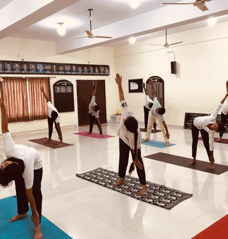 In this image a students doing yoga on world yoga day. Best P U College in Mysore, Residential P U College in Mysore, Best P U Colleges for Science, puc colleges near me.